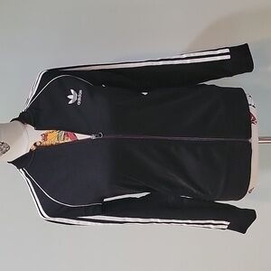 Vintage ADIDAS jogger full zip jacket.  Stripes down the sleeves.   Classic